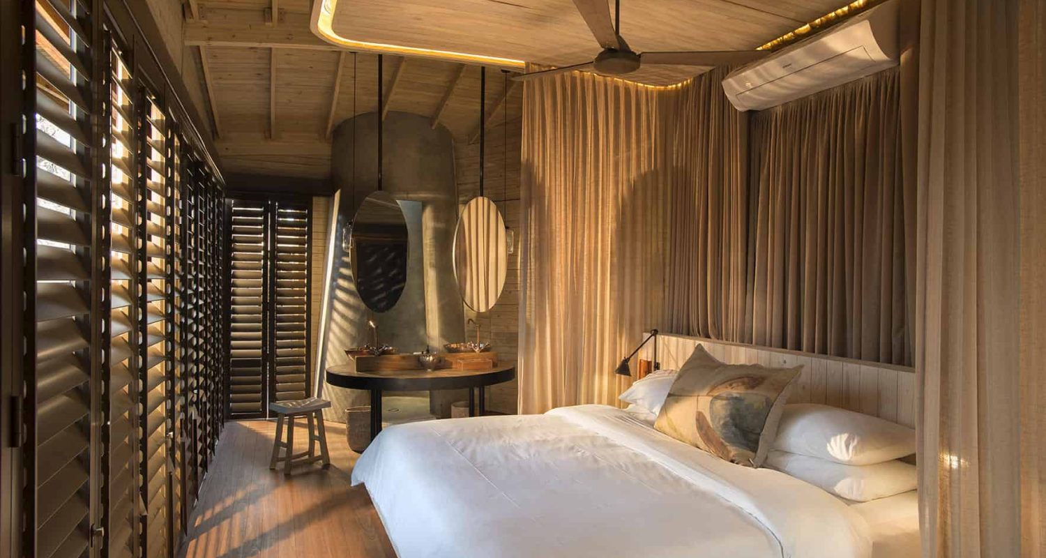 A guest bedroom at Sandibe Okavango Safari Lodge, Botswana